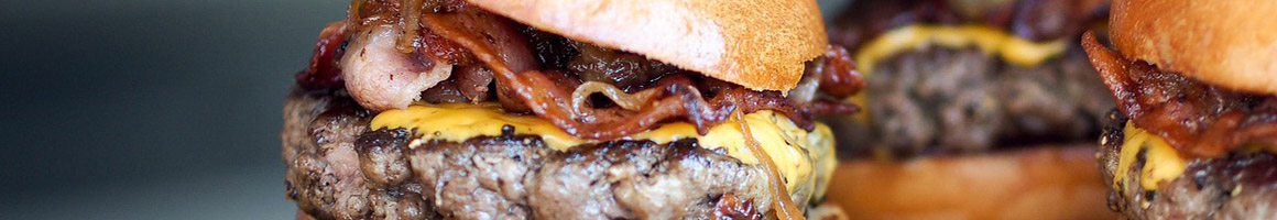 Eating Burger at Big Buns Damn Good Burgers restaurant in Arlington, VA.